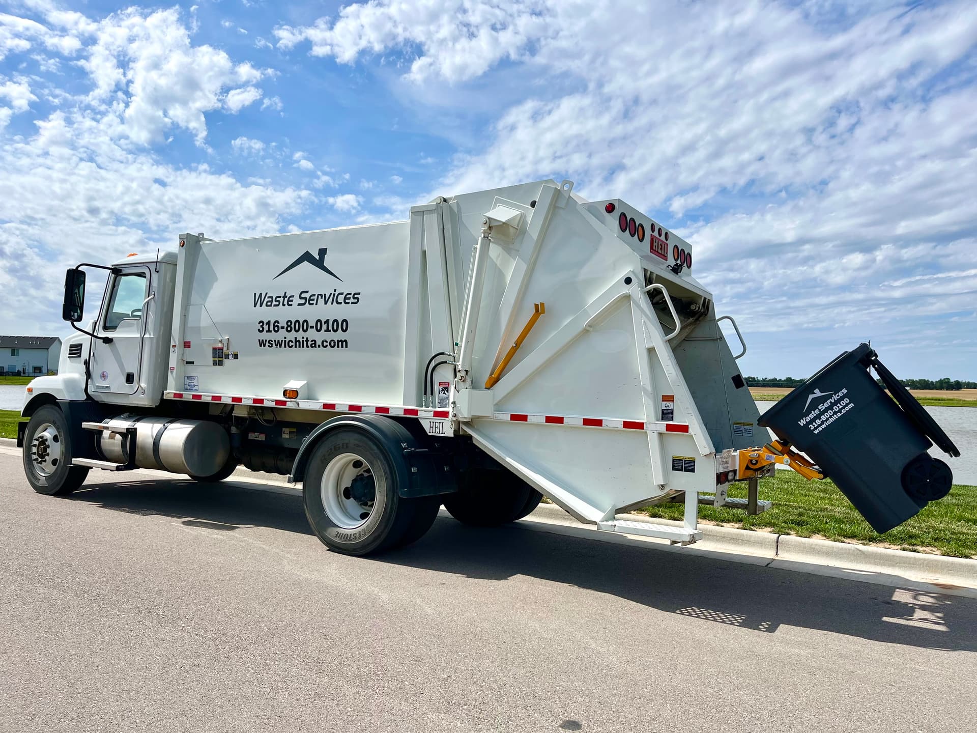 Waste Services of Wichita truck collecting trash